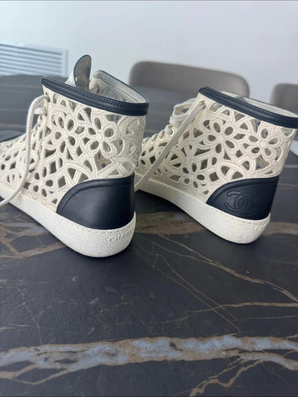 CHANEL Lace Cutout High-Top Sneakers — Cream with Black Toe